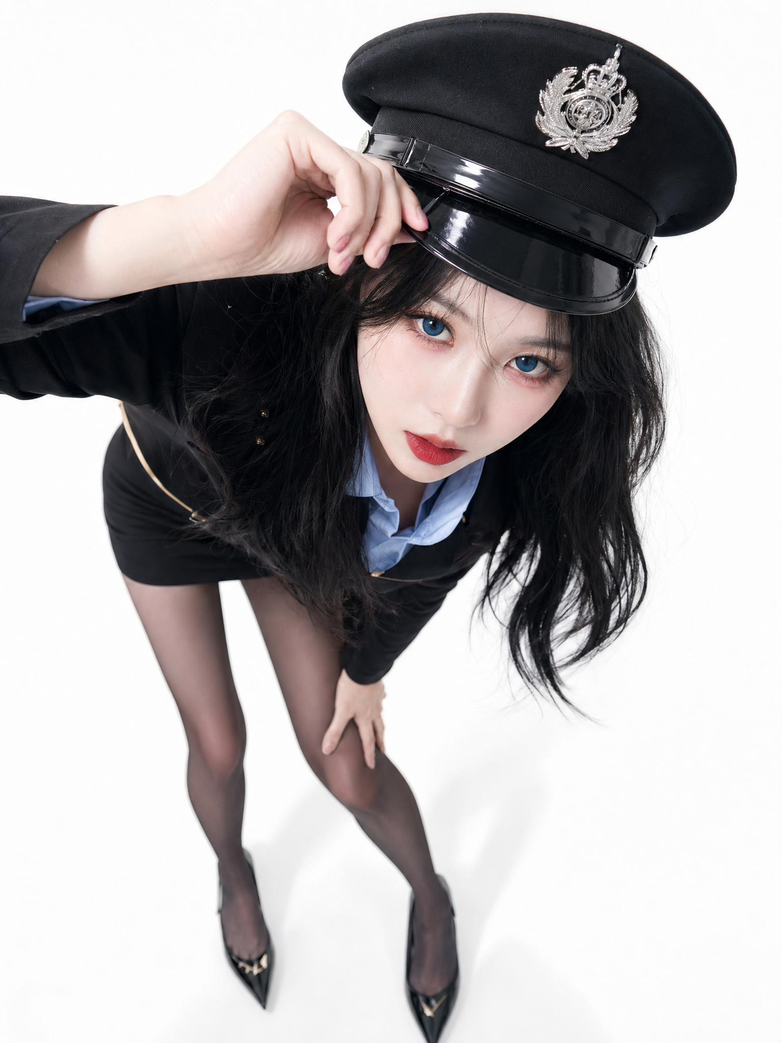 Studio editorial portrait steep high-angle looking down. Young woman leaning ex...